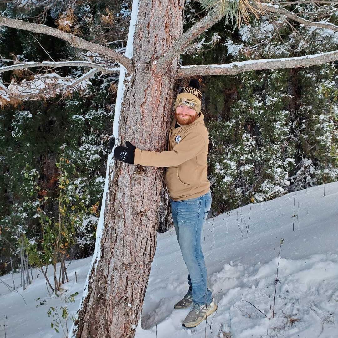Jeremy Hugging A Tree
